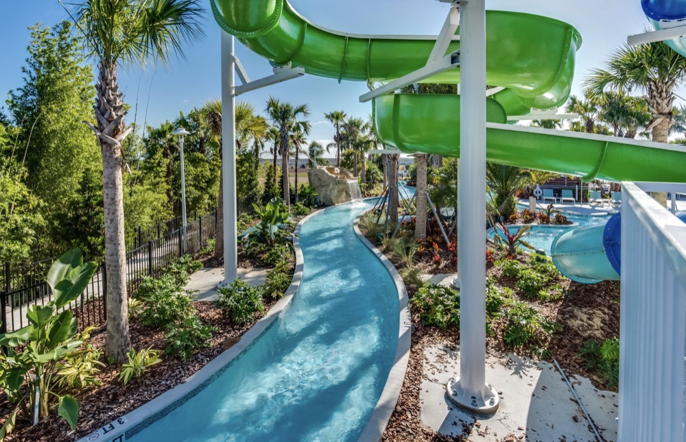 Lazy river winding past palm trees and water slides at Windsor Island Resort