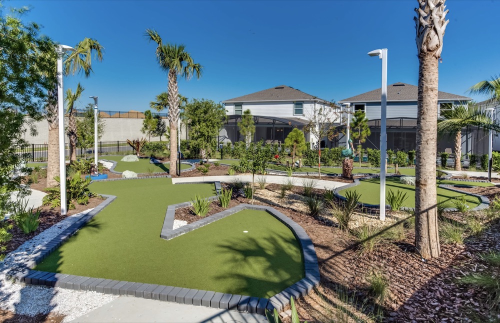 Landscaped miniature golf course lined with palm trees at Windsor Island Resort