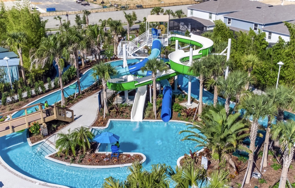 Green and blue twisting water slides above the pool at Windsor Island Resort